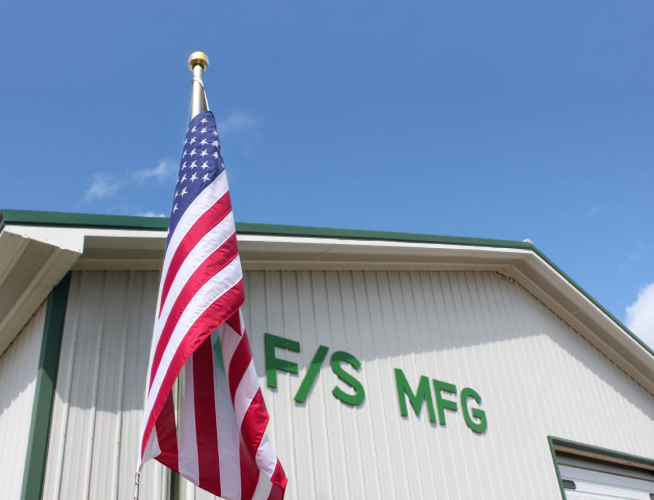 F/S Manufacturing Building Exterior With American Flag In Front